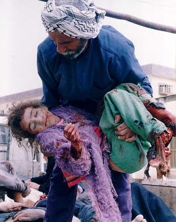 Iraqi girl, Basra. This is the sort of peace the USA and its vassals bring to Iraq. (Mike Moore  |  mirror.co.uk)