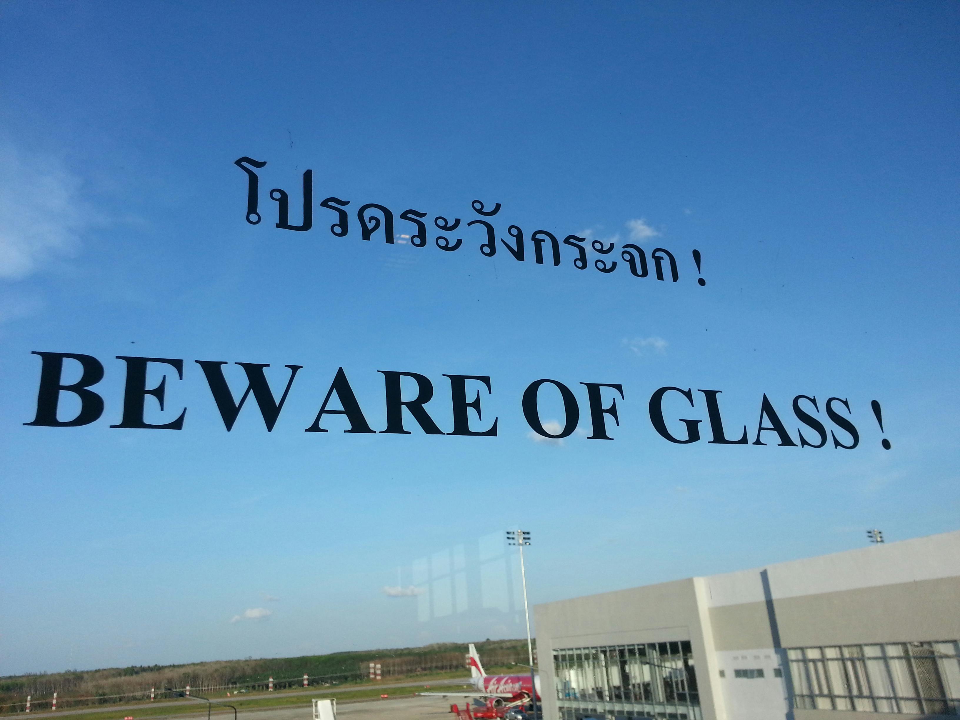 A pointless warning on a glass wall